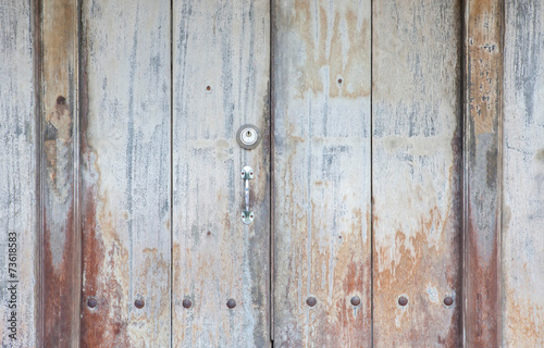 Metal door handle with lock on Vintage door