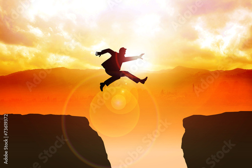 Man jumping over the ravine