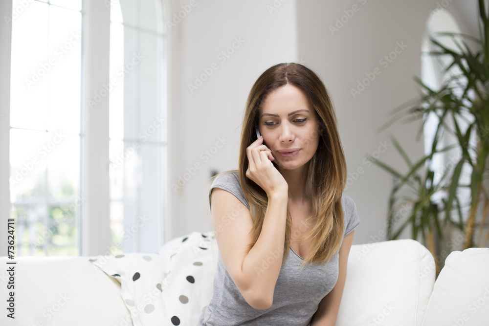 Pretty young woman talking on the mobile phone Pretty young woman talking on the mobile phone