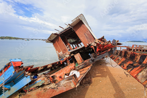 Old wooden boat stand on the beach