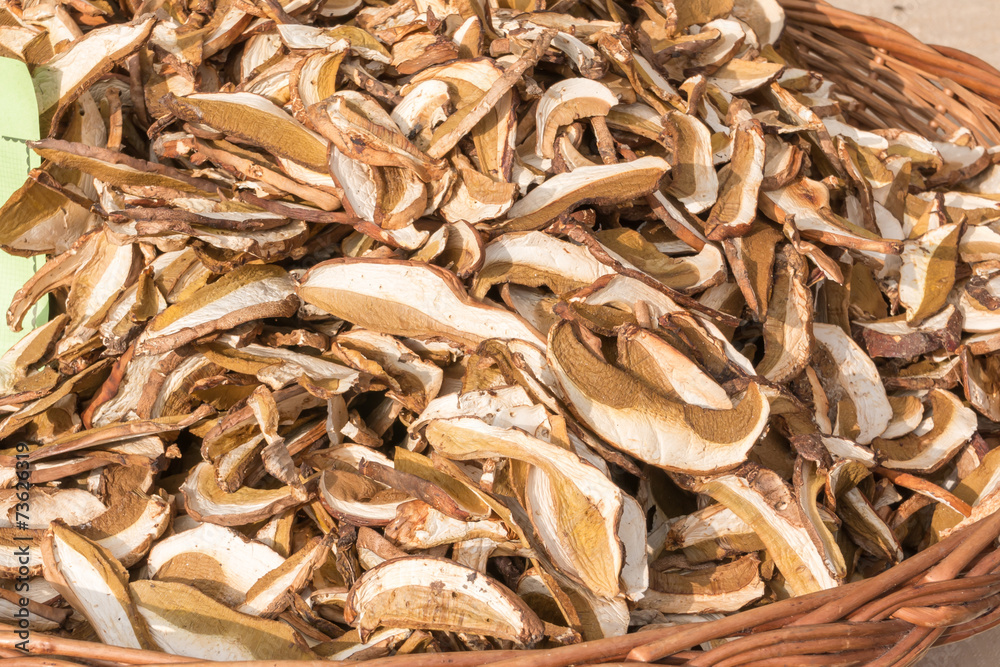 dried porcini mushrooms in wicker bowl