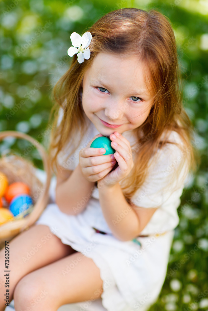 Little girl playing with Easter eggs Little girl playing with Easter eggs