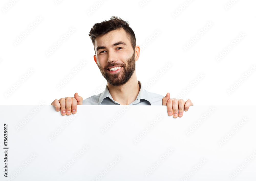 A young bearded man showing blank signboard, isolated over white A young bearded man showing blank signboard, isolated over white