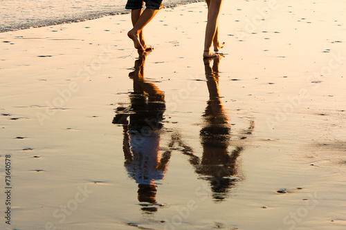 Romantic couple walking at sunset