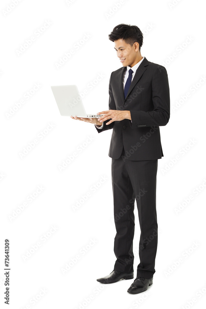 young smiling business man holding laptop young smiling business man holding laptop