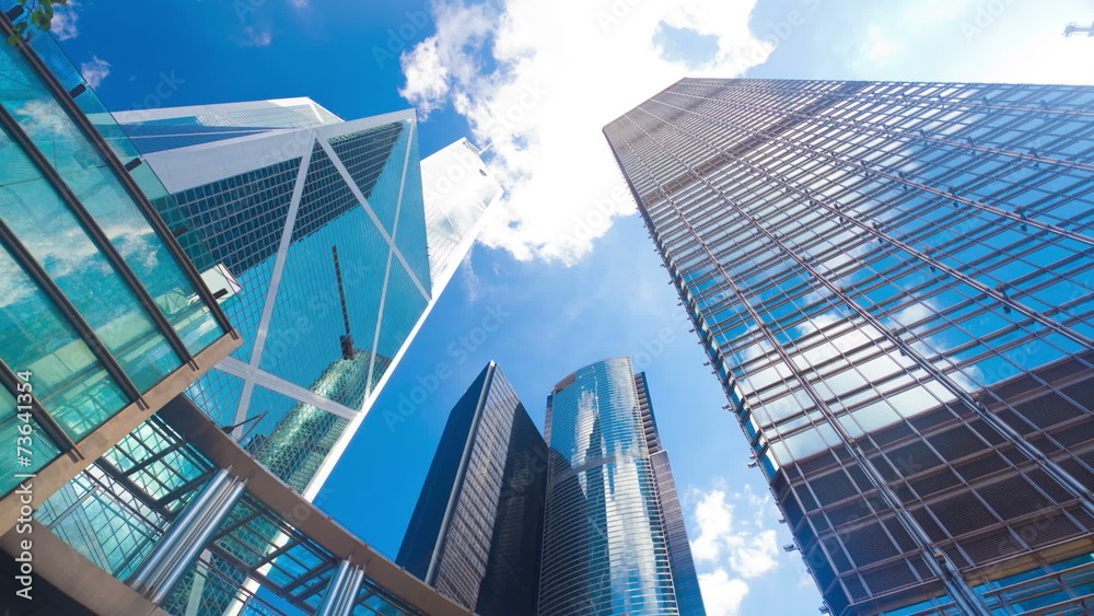 Timelapse video of office buildings with reflection of clouds