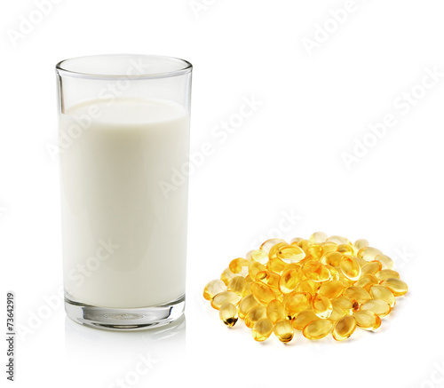 glass of milk and fish oil isolated on white background