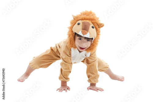 Cute little boy dressed in lion suit