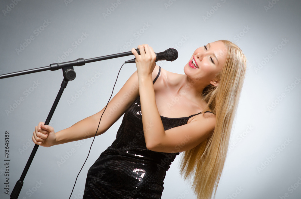 Woman singing in karaoke club