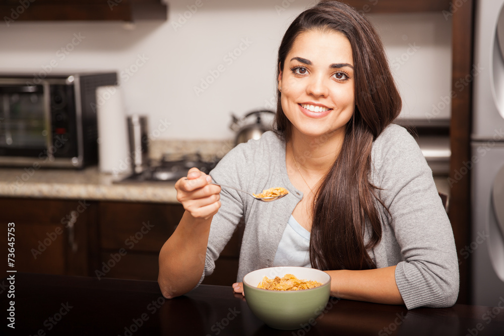Pretty girl eating cereal