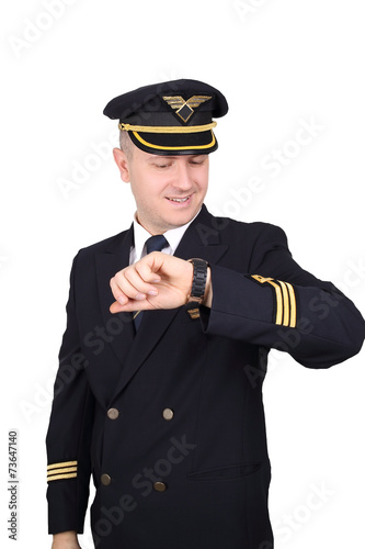 pilot looks at his watch on a white background