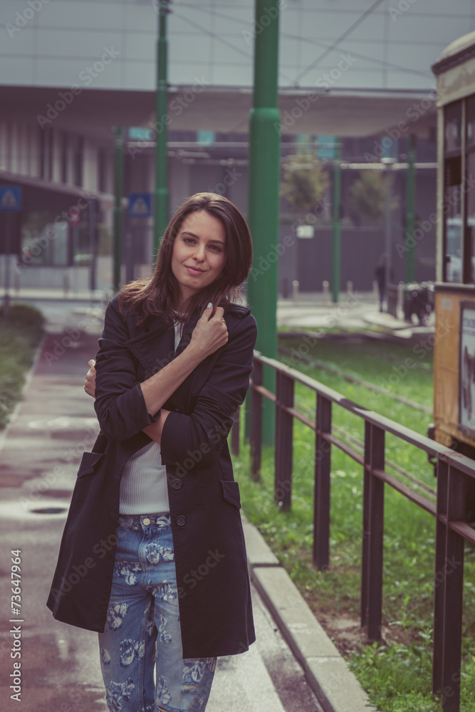 Pretty girl posing in the city streets