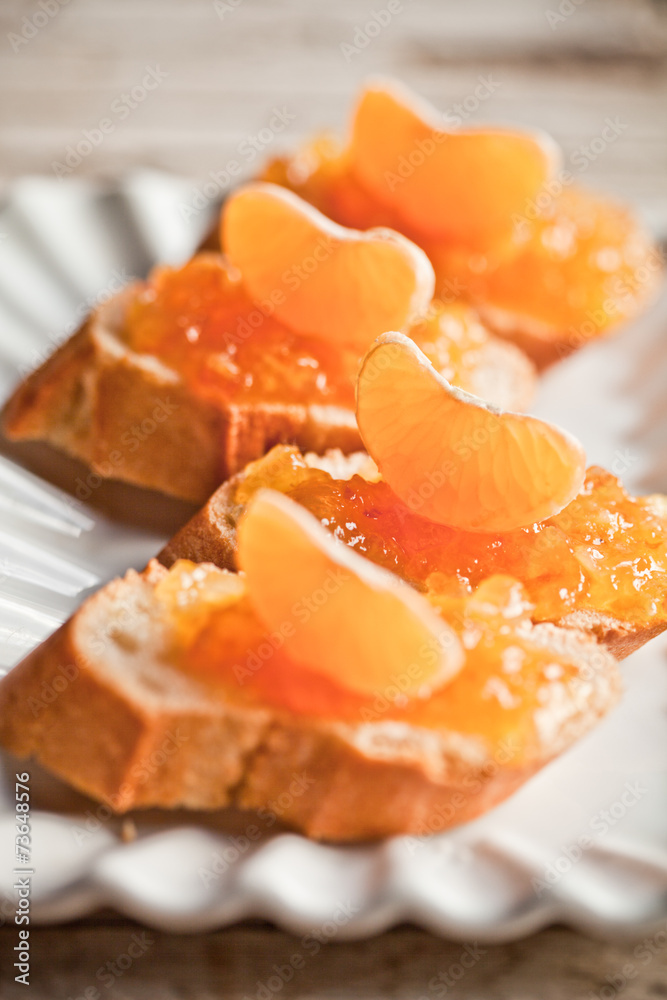 pieces of baguette with orange marmalade pieces of baguette with orange marmalade
