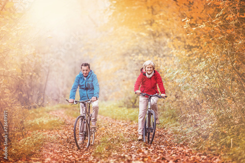 Active seniors ridding bike