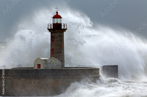 Huge wave over lighthouse