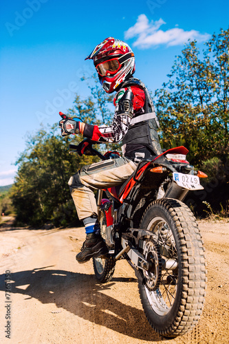 Fototapeta Naklejka Na Ścianę i Meble -  Motocross rider doing thumbs up.