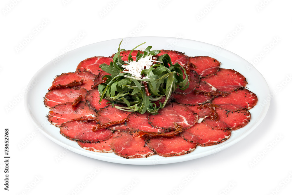 white dish with carpaccio of beef white dish with carpaccio of beef