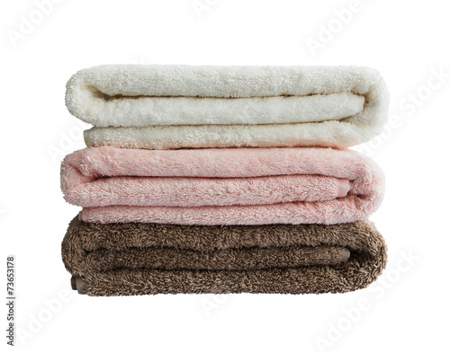 Bath towels in stack. White, pink, brown.