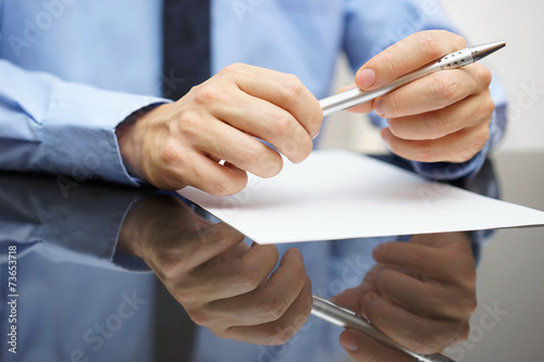closeup of business man reading document or contract