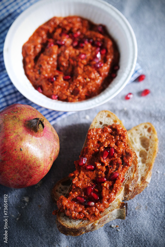 Red bell pepper relish with pomegranate syrup and seeds