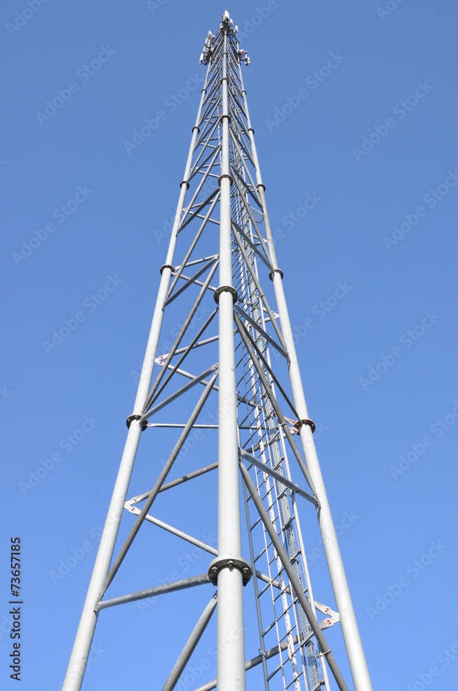 Telecommunication tower with antennas against the blue sky Telecommunication tower with antennas against the blue sky