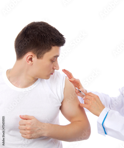 Doctor make flu vaccination or insulin injection