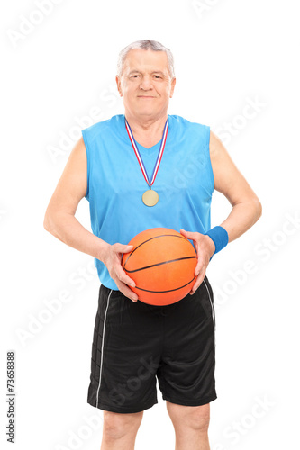 Mature basketball coach posing