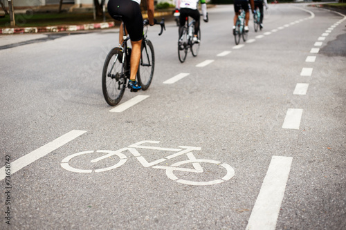 Bicycle sign or icon and movement  of cyclist in the park © SKT Studio