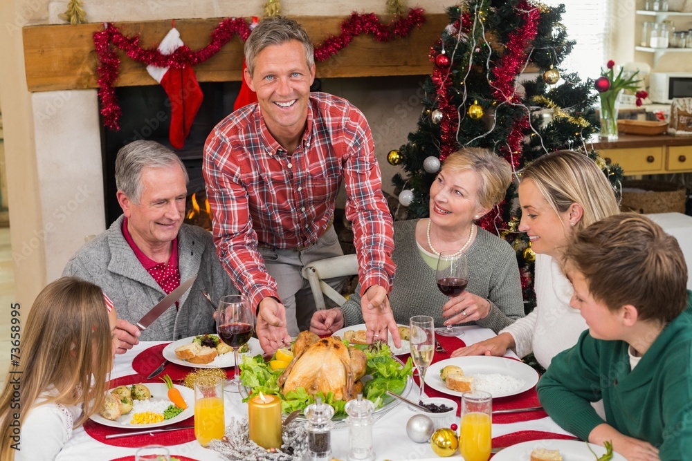 Man serving roast turkey at christmas Man serving roast turkey at christmas
