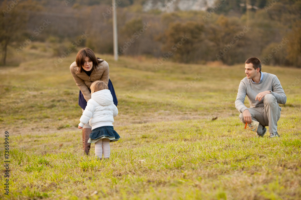 Fototapeta premium Mother Father and their little daughter