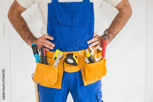 Handyman standing in tool belt