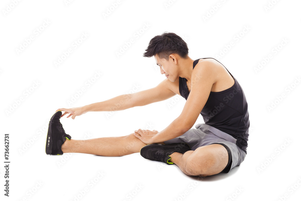 fitness man sitting and making stretching exercises fitness man sitting and making stretching exercises