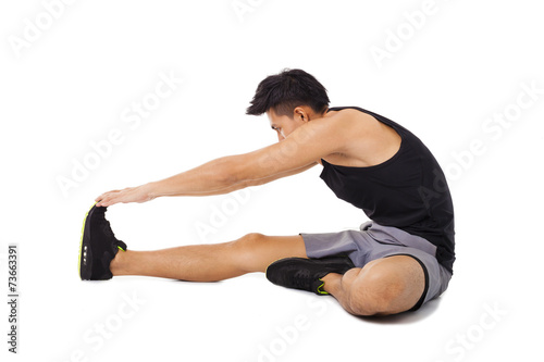 fitness man sitting and making stretching exercises