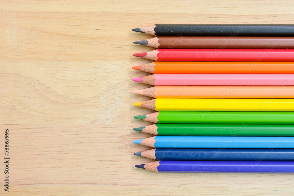 Obraz premium Color Pencils on wood texture