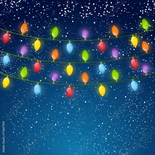 Christmas light bulbs on sky background