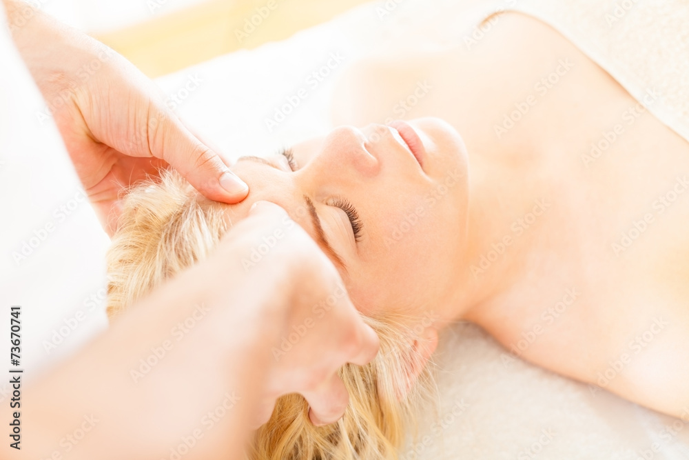 Massaging Forehead