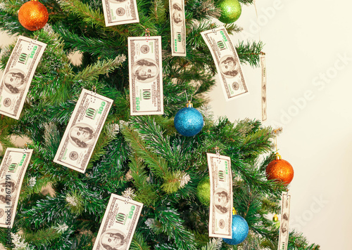 Christmas tree decorated with dollars notes