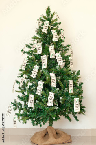 Christmas tree decorated with dollars notes