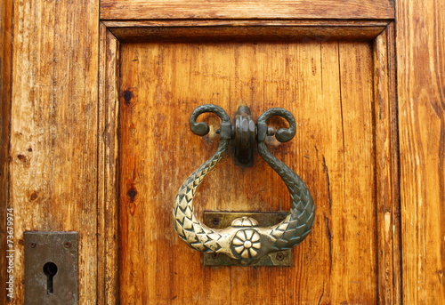Old wooden door with metal knocker