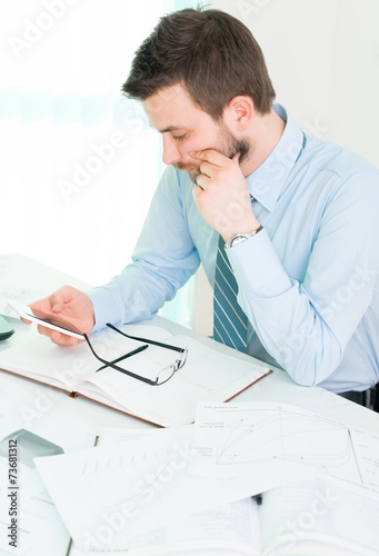 Young businessman in office