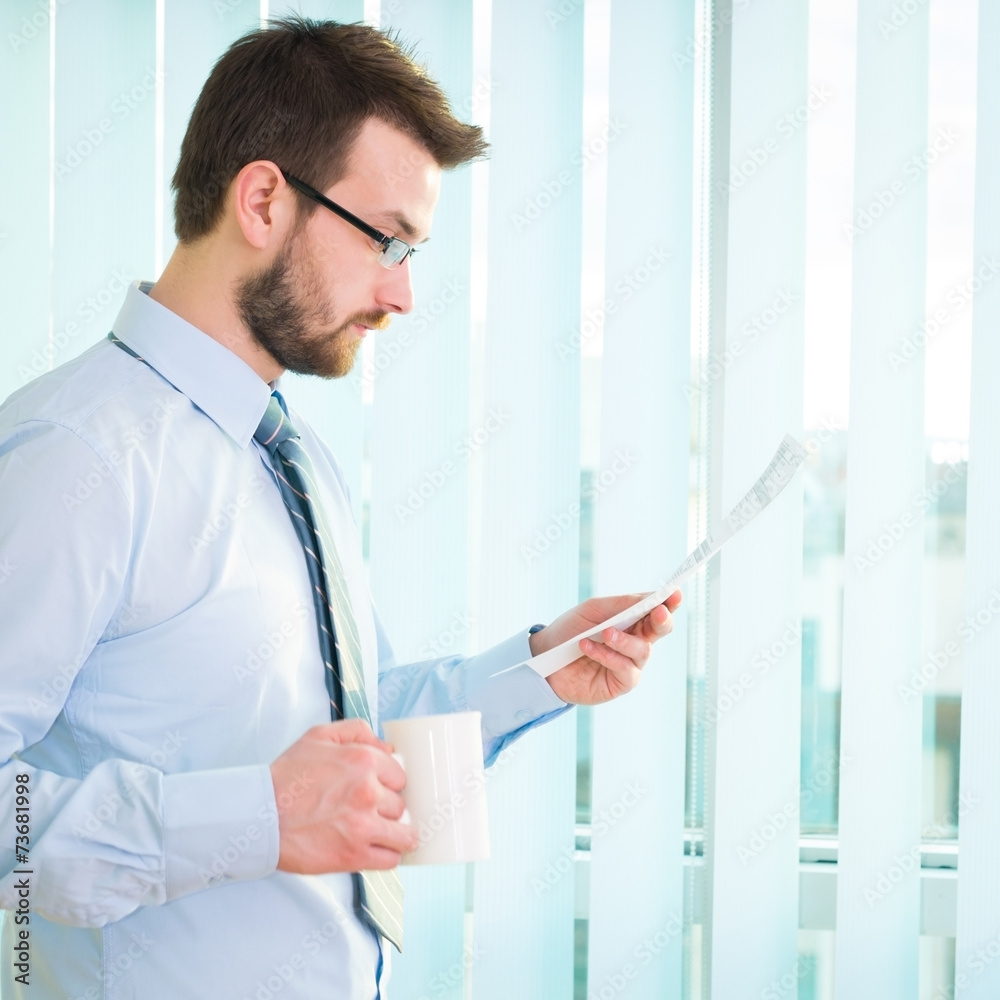 Fototapeta premium Young businessman in office.