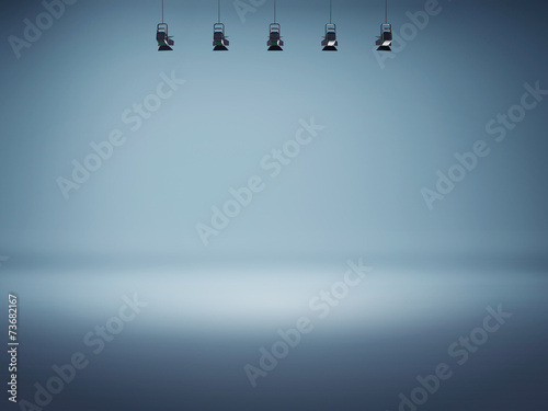 Blue spotlight background with lamps photo