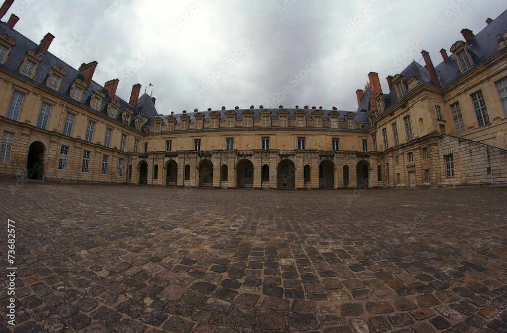 Cobbled courtyard of the palace of Fontainebleau in France