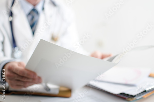 Doctor reading medical notes