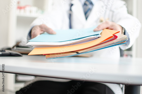 Doctor holding files photo