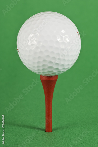Golf Ball On Red Tee