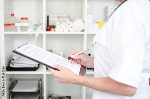 Female doctor taking notes