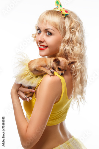 Beautiful glamour woman with small dog Chihuahua in hands