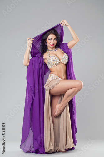 Portrait of the young sexy woman in purple tunic Arabic photo