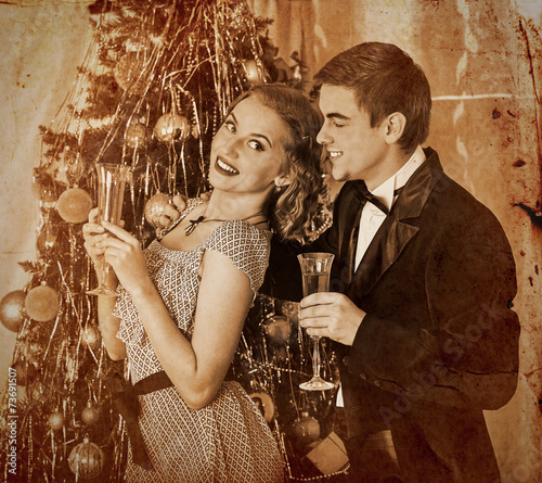 Couple on Christmas party.Sepia toned. photo